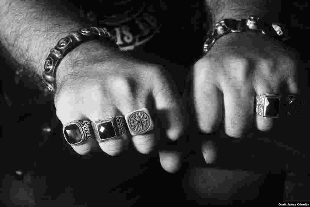 Ankara-based Turkish biker Adilhan Adiloglu shows off his rings while visiting the Cross Riders clubhouse and bar. &nbsp;He traveled from Turkey to Georgia and makes a point of connecting with bikers around the world via Facebook.