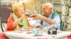 Happy pensioners drink wine in Italy