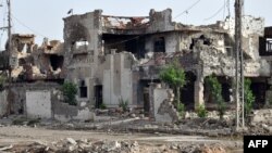 Зруйновані внаслідок боїв між урядовими силами і бойовиками будівлі у місті Рамаді, провінція Анбар, 24 червня 2014 року