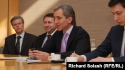 Moldova's deputy prime minister, Iurie Leanca (center), holds a hard drive containing a Holocaust-era archive of documents at the U.S. Holocaust Memorial Museum in Washington.