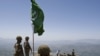 Pakistani soldiers stand guard on top of a mountain overlooking the Swat Valley. Will the government prevent the Taliban from coming back?