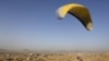 Afghan paraglider Zakia Mohammadi flies in Kabul on September 14.