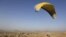 Afghan paraglider Zakia Mohammadi flies in Kabul on September 14.
