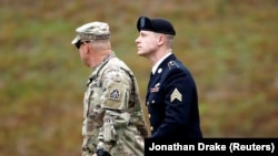 U.S. Army Sergeant Bowe Bergdahl (right) is escorted as he arrives at the courthouse for the start of sentencing proceedings in his court-martial at Fort Bragg, North Carolina, on October 23.