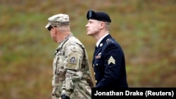 U.S. Army Sergeant Bowe Bergdahl, right, is escorted as he arrives at the courthouse for the start of sentencing proceedings in his court martial at Fort Bragg, North Carolina, U.S., on October 23.