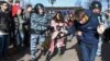 Russia -- Police officers detain protesters during an anti-corruption rally in central Moscow , March 26, 2017