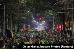 People march against widespread illegal logging and lack of official response in Bucharest in November 2019.