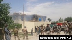 Security forces surround the provincial justice department in Jalalabad.