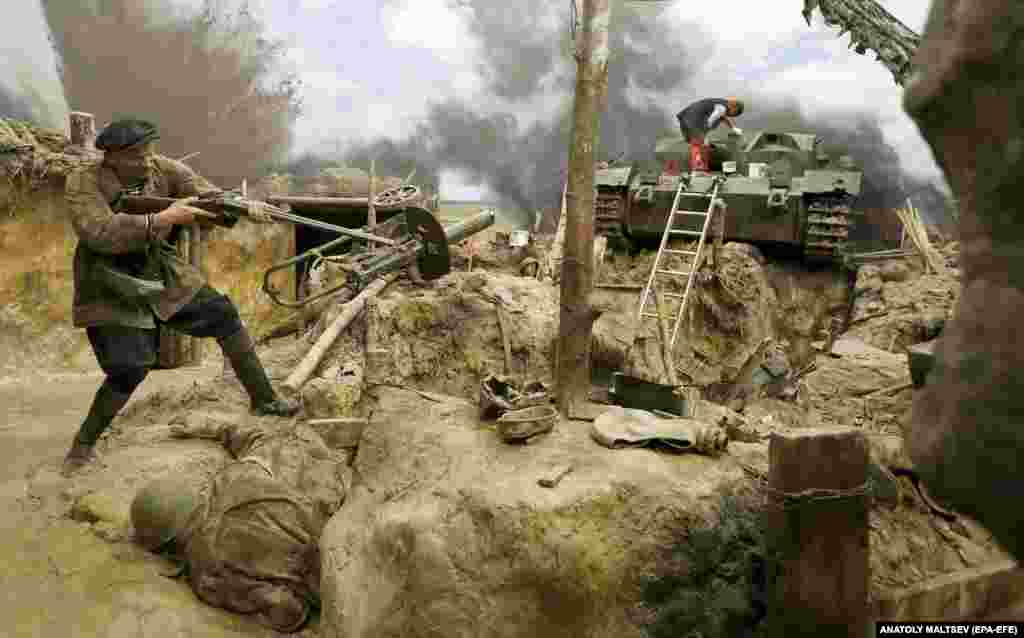 A figure representing an elderly man who gained fame by reportedly fighting Nazi troops with his hunting rifle before dying in battle alongside his soldier son in August 1941.