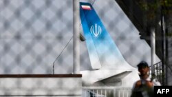 The airplane carrying Iranian Foreign Minister Mohammad Javad Zarif stands on the tarmac at the airport of the French seaside resort of Biarritz on August 25.