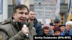 Former Georgian President and Odesa's ex-Governor Mikheil Saakashvili speaks to his supporters during a rally outside the Ukrainian parliament in Kyiv on November 7. 