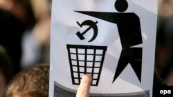 A student holds up a sign during an anticommunist demonstration in Chisinau in 2009.