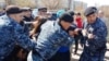 Полицейские задерживают участников несанкционированного протеста в Астане. 10 мая 2018 года.