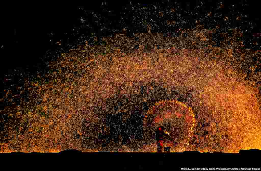 Photographer&nbsp;Wang LiJun of China:&nbsp;Hitting Tree Flowers &ldquo;Hitting Tree Flowers&rdquo; is the local terminology used to describe a tradition of He Bei Province that has been around for over 500 years. People spread molten iron onto the ancient city walls and the iron splashes into beautiful sparkles, which locals call &ldquo;tree flowers.&rdquo;