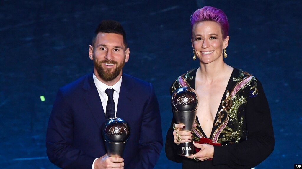 Best FIFA Men's Player of 2019, Argentina and Barcelona forward Lionel Messi (L) and Best FIFA Women's Player of 2019, US and Reign FC midfielder Megan Rapinoe pose at the end of The Best FIFA Football Awards ceremony, on September 23, 2019 in Milan.