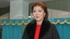 Дарига Назарбаева, старшая дочь президента Казахстана Нурсултана Назарбаева, на избирательном участке в Астане. 15 января 2012 года.