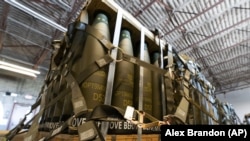 A U.S. C-17 cargo aircraft is loaded with 155-mm shells and fuses, ultimately bound for Ukraine. 