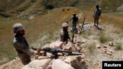 Afghan border police hold their positions in the Goshta district of Nangarhar Province, where Afghanistan shares a frontier with Pakistan.