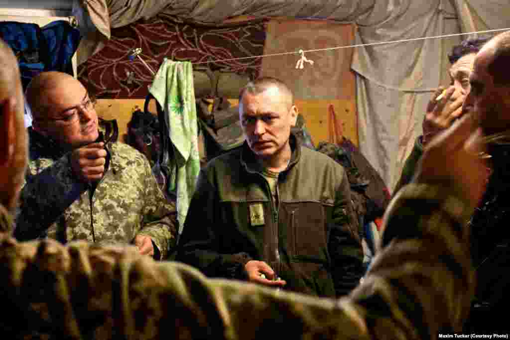 Officers get an update on clashes and enemy activity during a briefing at a command post in Pisky, eight kilometers from Avdiyivka&nbsp;on the southern flank of the battle. April 2, 2016