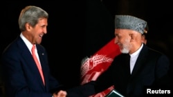In addition to the two candidates, U.S Secretary of State John Kerry (left) will meet with Afghan President Hamid Karzai in Kabul.