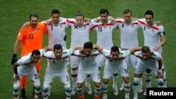 Iran's national soccer players pose for a team photo during their 2014 World Cup, June 25, 2014. Iran has again qualified for the 2018 World Cup.