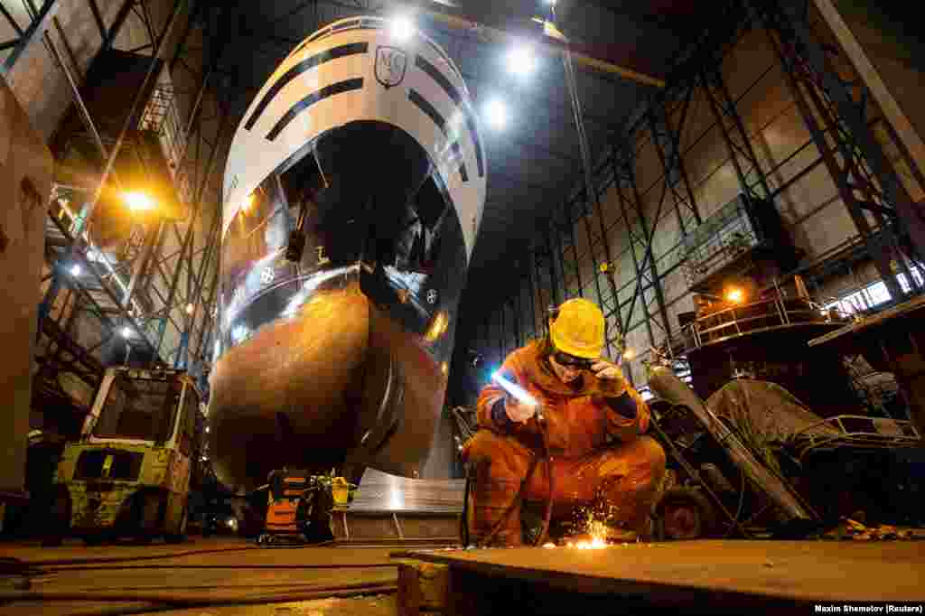 A welder inside a shipyard in Kirkenes, which gets most of its business repairing Russian vessels. The owner of the business told Reuters: &ldquo;I don&rsquo;t like that they build up the military on both sides of the border.... Here in the north, we work together to reduce tensions. We are trying not to be part of them.&rdquo;