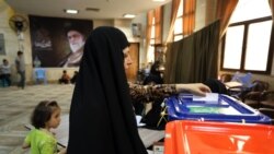 An Iranian woman casts her vote at a polling station in Tehran.
