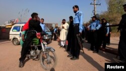 Police blocked the road leading to the house of Pakistani opposition leader Imran Khan in Islamabad, Pakistan, on October 28.