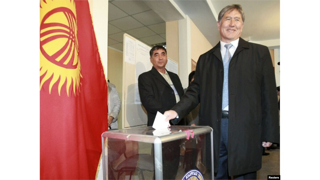 Until recently the prime minister, presidential candidate Almazbek Atambaev casts his ballot during the presidential election at a polling station in Bishkek on October 30.