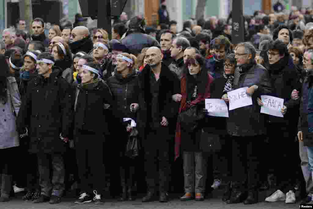 Family members and relatives of the 17 victims take part in the march.