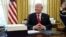 U.S. President Donald Trump sits at his desk before signing tax overhaul legislation in the Oval Office of the White House in Washington on 22, 2017.