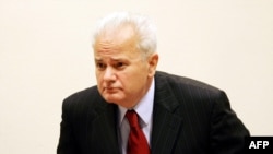 Lessons for Putin? Milosevic arrives for the start of his war crimes trial in the Hague in July 2004.