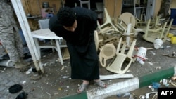 Upturned tables and chairs outside a restaurant following twin blasts in the southern Iraqi city of Karbala on November 25.