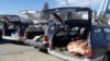 FILE: Cars are loaded with the bodies of civilians allegedly killed in a military operation by international forces in Zurmat district of Paktia province in December 2018.