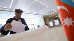 An Azeri man casts his ballot at a polling station during a presidential elections in Baku, April 11, 2018