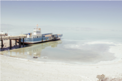 A photo by Solmaz Daryani shot in 2014 shows a ferry left stranded by the receding water of Lake Urmia.