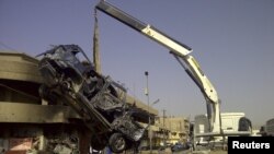في موقع احد الانفجارات ببغداد 13حزيران2012