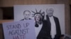 Плакат с изображением Дональда Трампа и Владимира Путина на антитрамповской демонстрации в Аризоне. Финикс, 22 августа 2017 года.