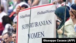 A banner reading "Support Iranian women to attend stadiums" is displayed during the Russia 2018 World Cup in Saint Petersburg, June 15, 2018