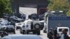 Armenia - Police vehicles block a road leading a police station in Yerevan seized by radical opposition activists, 17Jul2016.