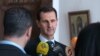 Assad viziton ushtarët në Guta