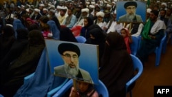 FILE: Supporters of Gulbuddin Hekmatyar, the leader of Hizb-i-Islami, attend a meeting in Herat. 
