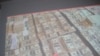  Пачки долларов из якобы «черной кассы» Мухтара Джакишева. Видеосъемка КНБ. Астана, 1 июня 2009 года. 