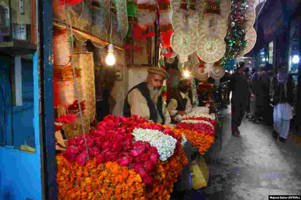 A flower shop in a tiny alley.