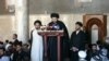 Muqtada al-Sadr speaks during Friday Prayers at the Al-Kufah Mosque in Al-Najaf in 2006.