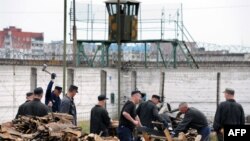 Just another day at the mill? Inmates chop wood at Belarus's largest prison, in Bobruiisk.