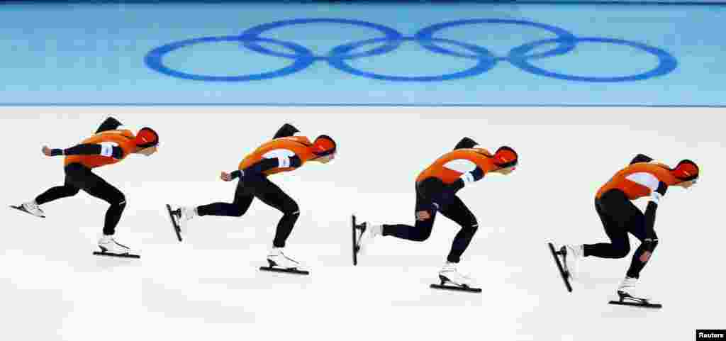 A multiesposure image captures the Netherlands' Jan Blokhuijsen in action during the men's 5,000 meters speed skating race. 