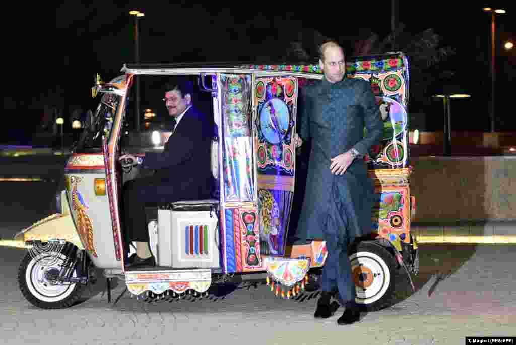 Prince William steps out of a brightly decorated "tuk-tuk" on his arrival to a gathering in Islamabad, the Pakistani capital.