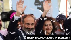 ARMENIA - Newly elected Prime Minister of Armenia Nikol Pashinian (L) greets supporters during a meeting in Republic Square in Yerevan, Armenia May 8, 2018