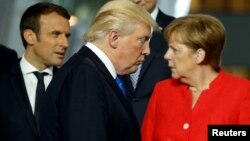 Nakon izbora Trampa sve veće razmimoilaženje EU i SAD (na fotografiji: Makron, Tramp i Merkel)